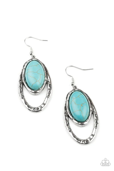 Paparazzi Accessories Pasture Paradise- Blue An oval turquoise stone is pressed into a hammered silver fitting that attaches to the top of a hammered silver oval frame, creating a rustic lure. Earring attaches to a standard fishhook fitting. Sold as one p