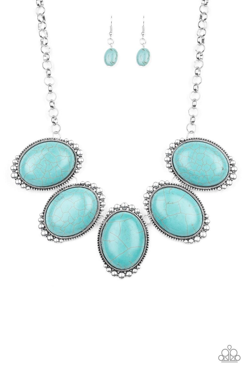 Paparazzi Accessories Prairie Goddess - Blue Chiseled into tranquil ovals, oversized turquoise stones are pressed into antiqued silver frames radiating with studded textures. The refreshing frames delicately link below the collar for a statement-making fi