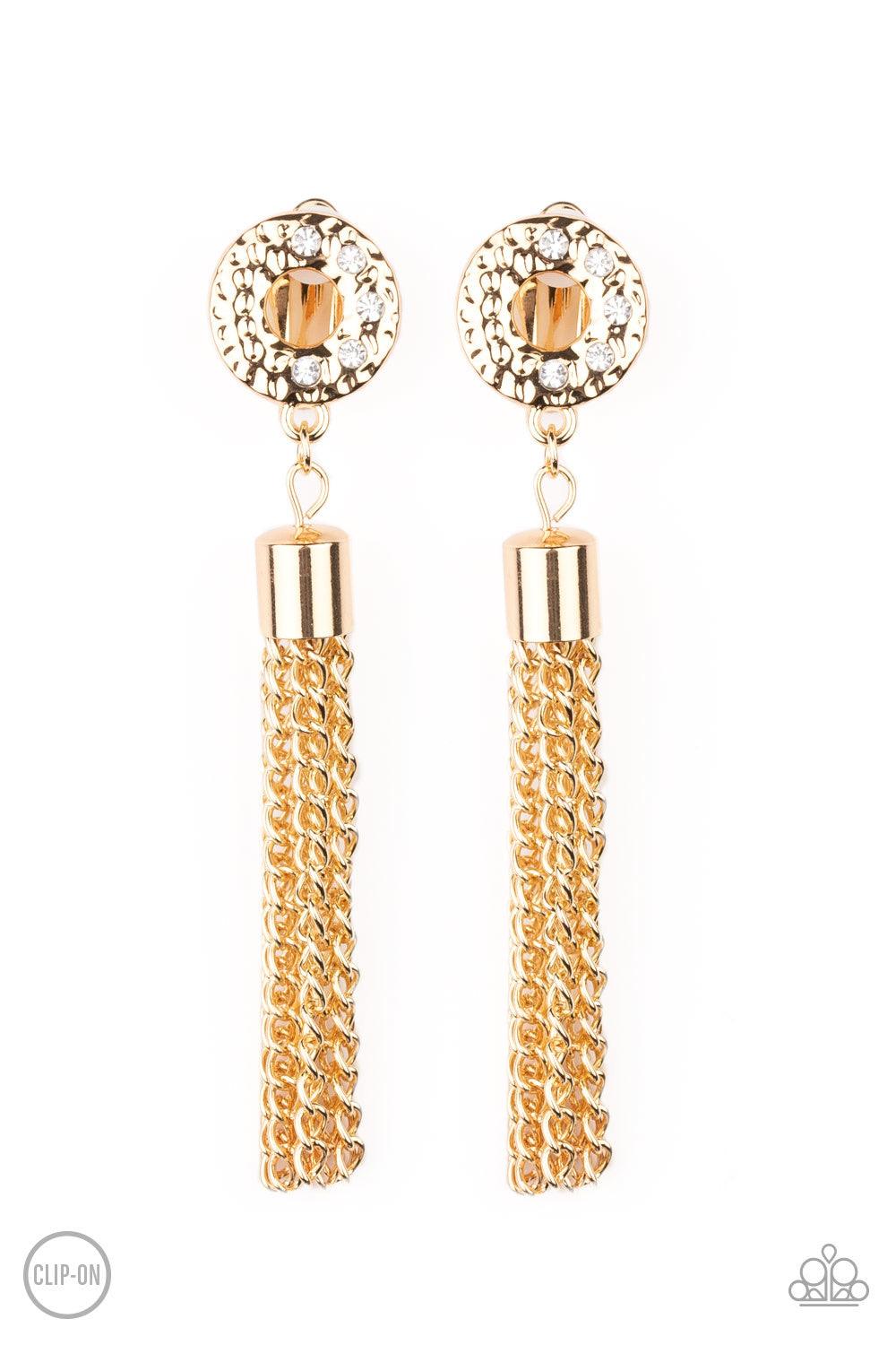 Paparazzi Accessories Perfectly Prestigious ~Gold *Clip-On A glistening gold tassel swings from the bottom of a hammered gold ring encrusted in sections of glassy white rhinestones for a refined look. Earring attaches to a standard clip-on fitting.