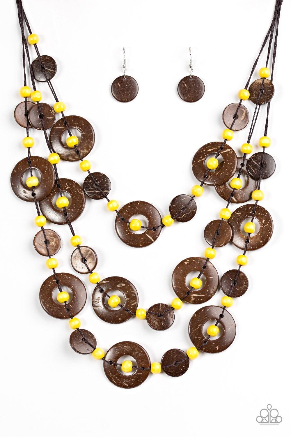 Paparazzi Accessories Bahama Bungalow - Yellow Brushed in a distressed finish, wooden discs link into three summery rows below the collar. Round yellow beads are knotted between the wooden accents, adding colorful accents to the seasonal palette. Features