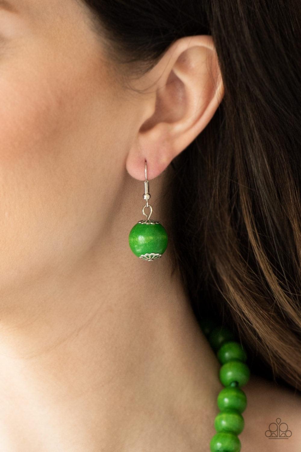 Paparazzi Accessories Effortlessly Everglades - Green Gradually increasing in size near the center, vivacious green wooden beads are threaded along a green string for a summery look. Features an adjustable sliding knot closure. Jewelry
