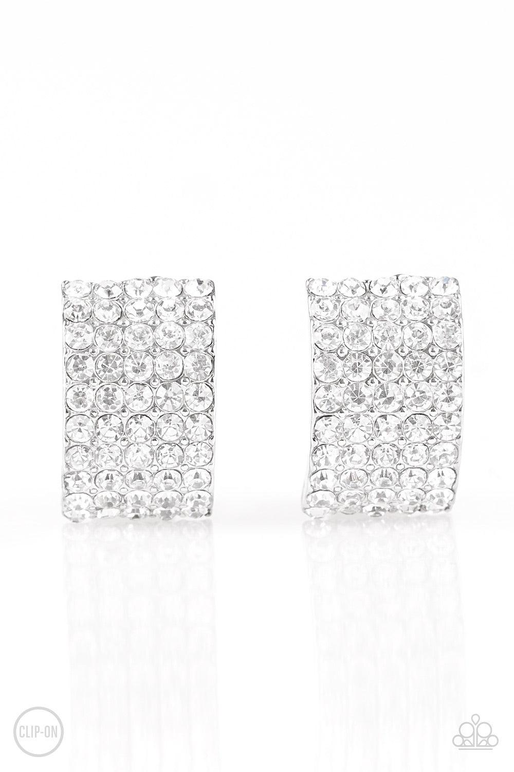 Paparazzi Accessories Hollywood Hotshot - White *Clip-On Encrusted in row after row of glassy white rhinestones, a radiant silver ribbon curls around the ear for a glamorous look. Earring attaches to a standard clip-on fitting. Jewelry
