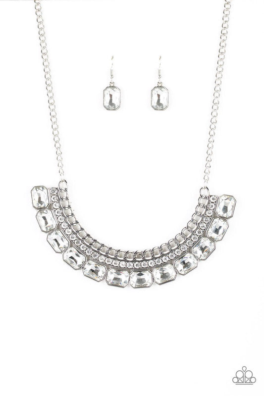 Paparazzi Accessories Killer Knockout - White Stationary rows of shimmery silver chain, glittery white rhinestones, and glassy white emerald-cut gems coalesce into a bold pendant below the collar. Features an adjustable clasp closure. Jewelry