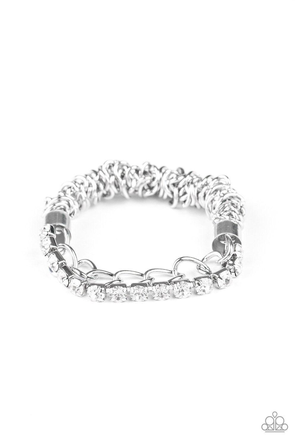 Paparazzi Accessories Glamour Grid - White Infused with oversized silver fittings, a strand of glittery white rhinestones and exaggerated silver chain connect to a classic silver chain that has been threaded along a stretchy band for a versatile fit. Sold