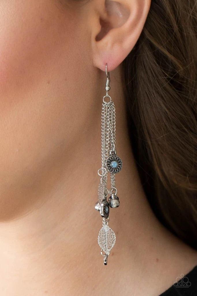 Paparazzi Accessories A Natural Charmer - Blue Dewy Cerulean rhinestone dotted frames, airy silver leaves, silver disco ball-like beads stream from the bottoms of dainty silver chains, creating a whimsically tasseled display. Earring attaches to a standar