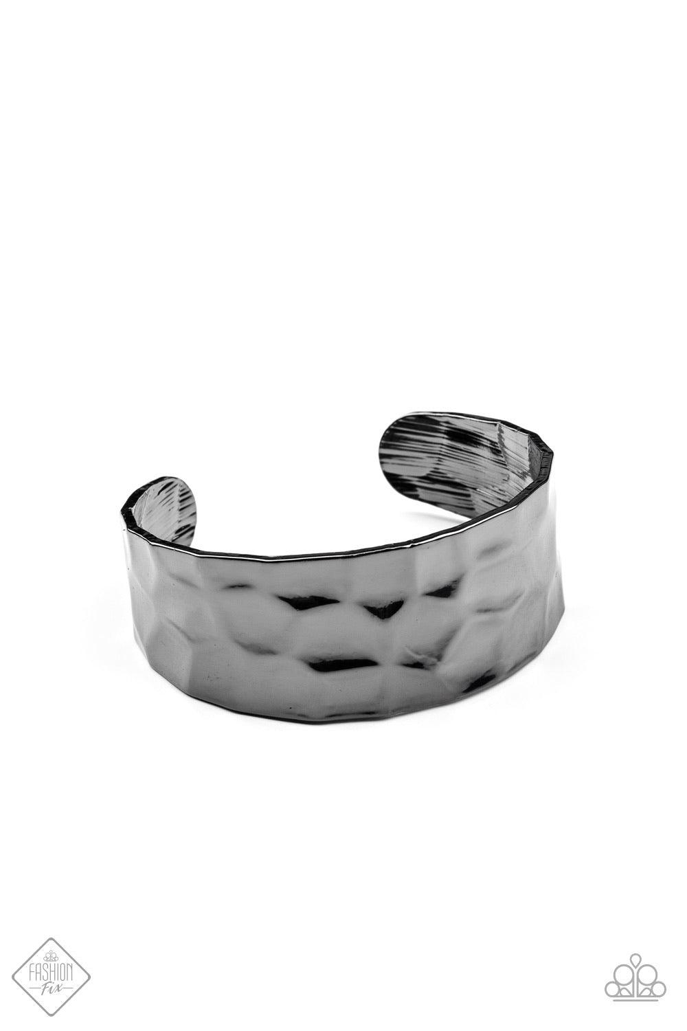 Paparazzi Accessories Is It HAUTE In Here? - Black A shimmery gunmetal cuff hammered in texture wraps around the wrist for a bold pop of industrial inspiration. Sold as one individual bracelet. Jewelry