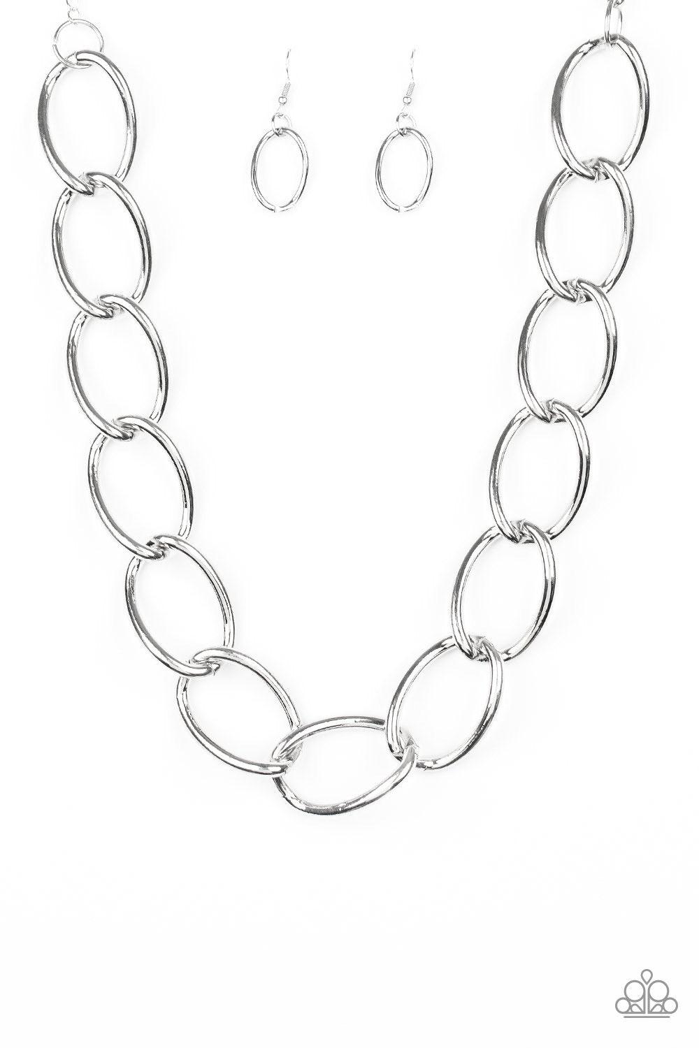 Paparazzi Accessories The Challenger - Silver Dramatically oversized silver links connect below the collar for an exaggerated industrial style. Features an adjustable clasp closure. Jewelry