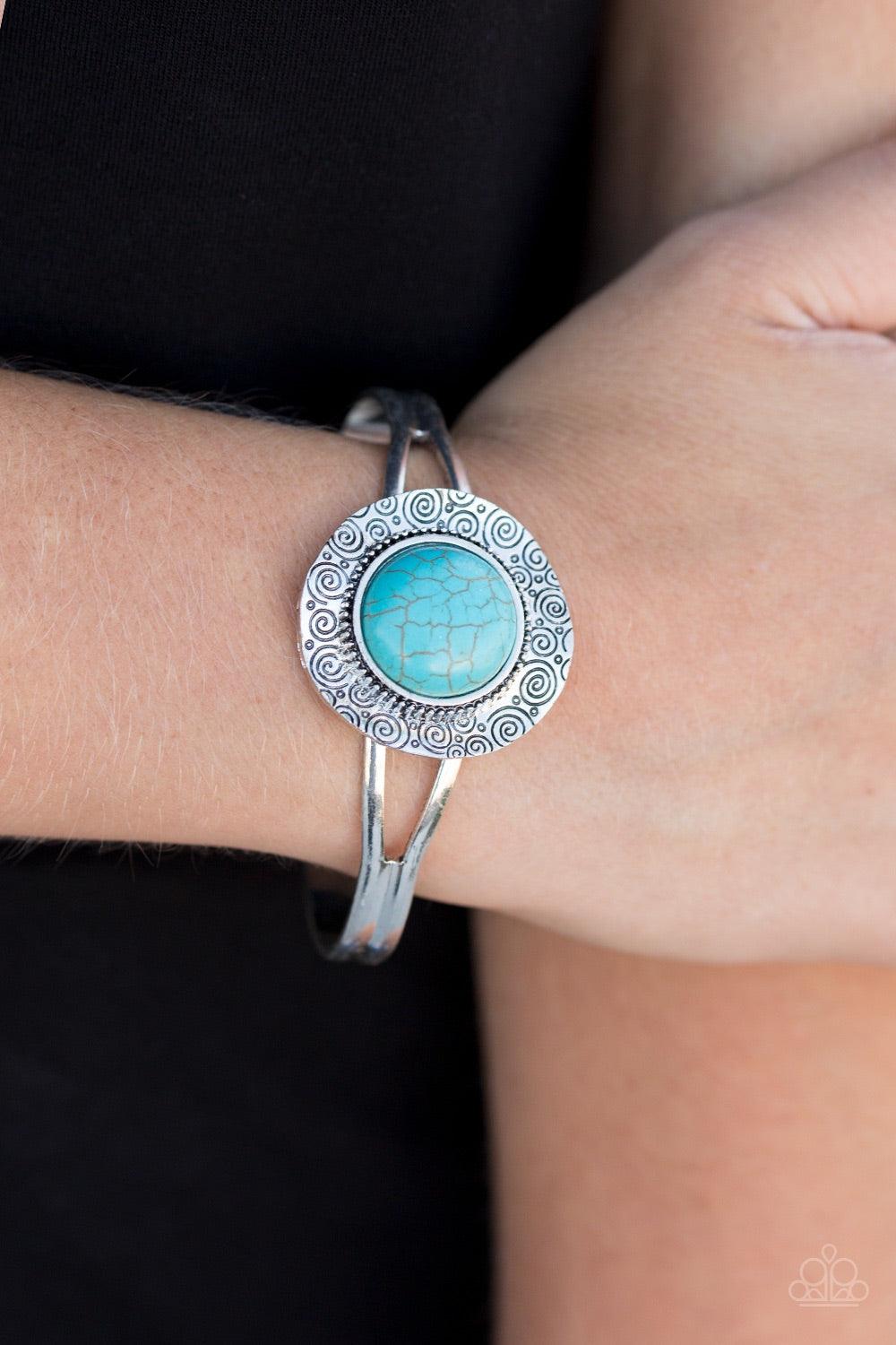 Paparazzi Accessories Natural Environment - Blue Stamped in dizzying swirls, a delicately hammered silver frame spins around a turquoise stone center, creating a handcrafted inspired cuff. Jewelry