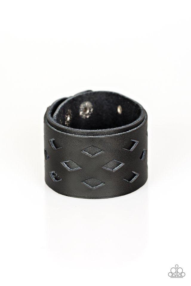Paparazzi Accessories Bucking Bronco - Black Featuring airy diamond-shape cutouts, a black leather band is studded in place along a thicker black leather band for a rustic look. Features an adjustable snap closure. Jewelry