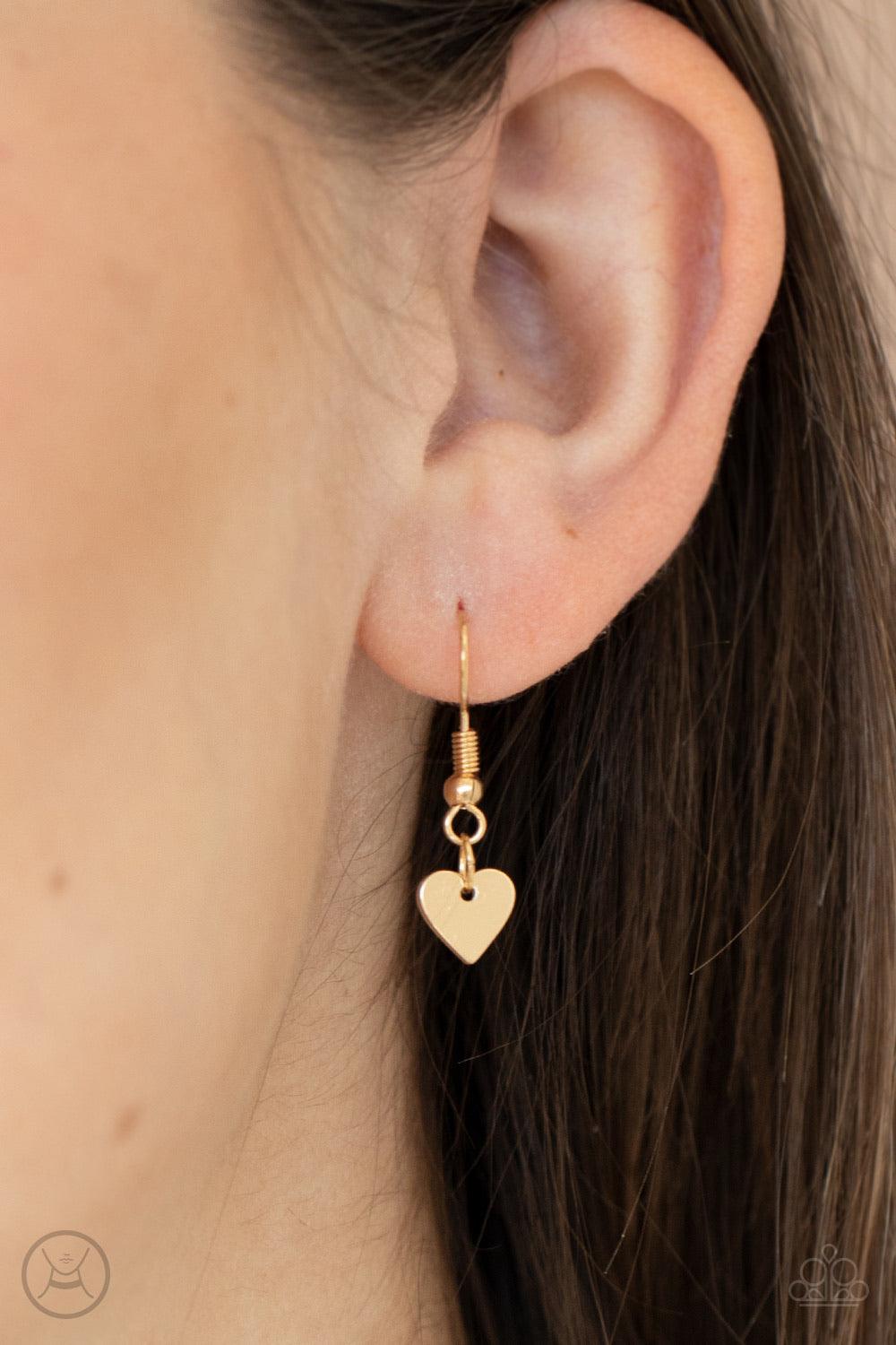 Paparazzi Accessories Love Conquers All - Gold Nestled between a pair of dainty gold hearts, dangling gold letter charms spell out the word, "LOVE," creating a flirty fringe around the neck. Features an adjustable clasp closure. Sold as one individual cho