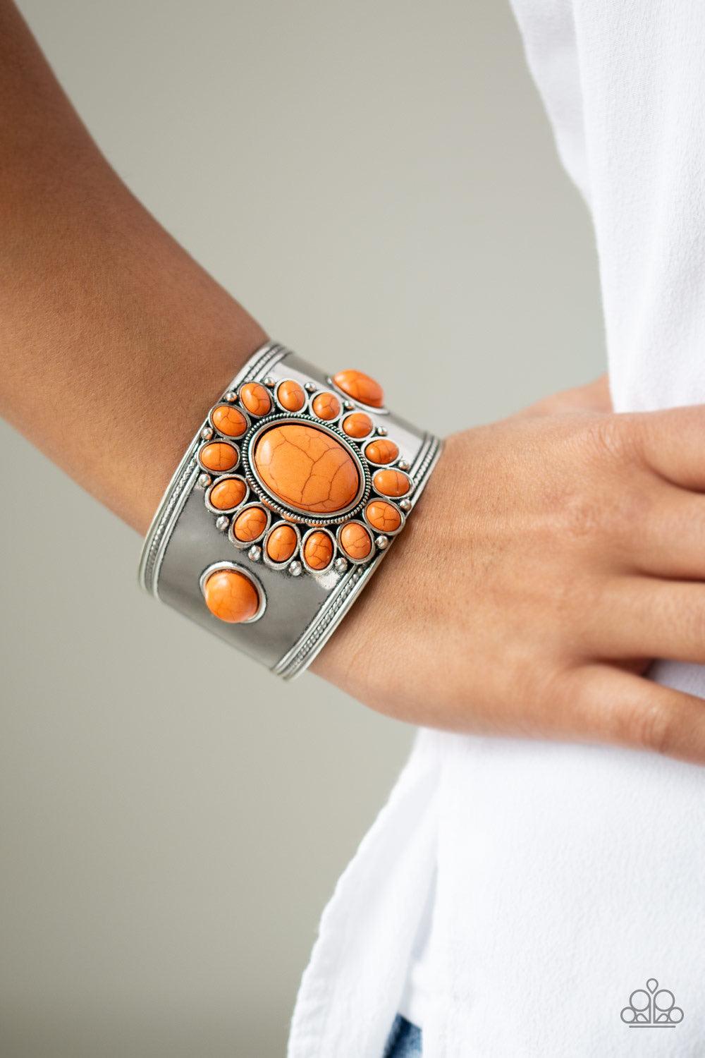 Paparazzi Accessories Room to Roam ~Orange Refreshing orange stones are pressed into the center of a thick silver cuff, creating a dramatic floral frame atop the wrist.