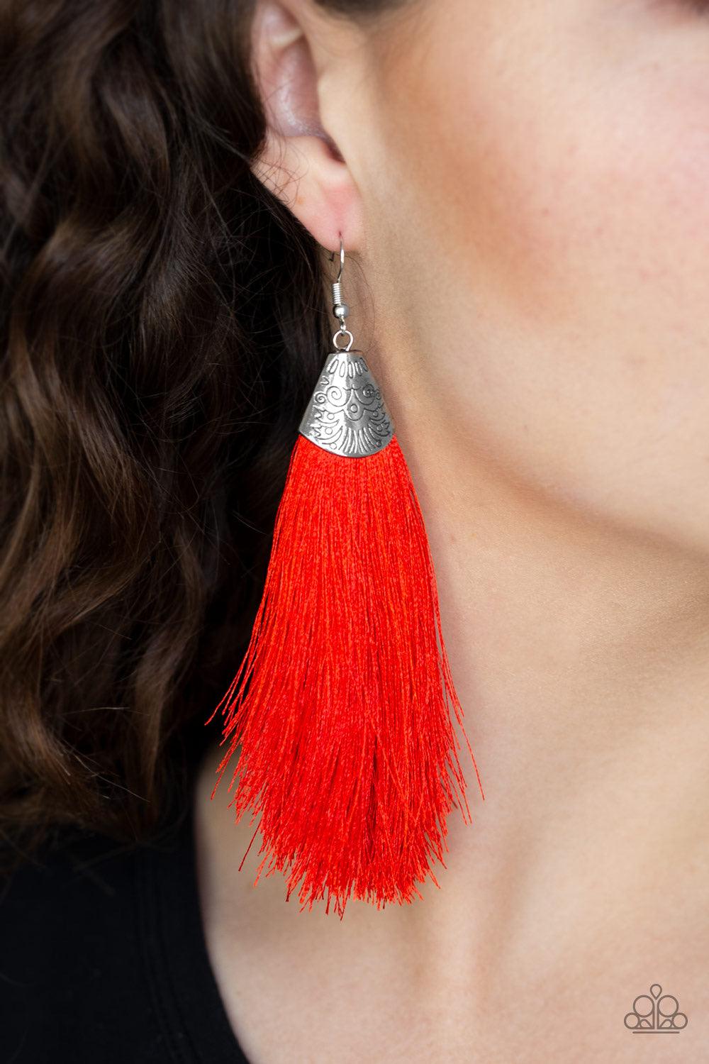 Paparazzi Accessories Tassel Temptress - Red A plume of soft red thread is pinched between a shimmery silver fitting stamped in tribal inspired textures, creating a foxy tassel. Earring attaches to a standard fishhook fitting. Jewelry