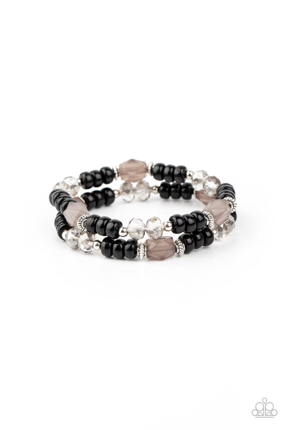 Paparazzi Accessories Delightfully Dainty - Black A shiny collection of smoky gems, dainty silver accents, white crystal-like beads, and polished black beads are threaded along stretchy bands around the wrist for a whimsically layered look. Sold as one pa