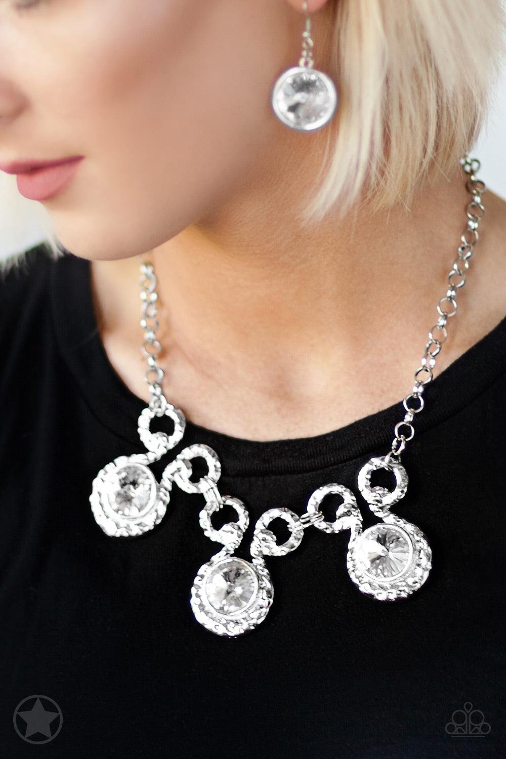 Paparazzi Accessories Hypnotized - Silver Three dramatically oversized rhinestones are nestled into three textured silver fittings that are connected by oval silver rings, creating a brilliant statement piece. Features an adjustable clasp closure. Jewelry