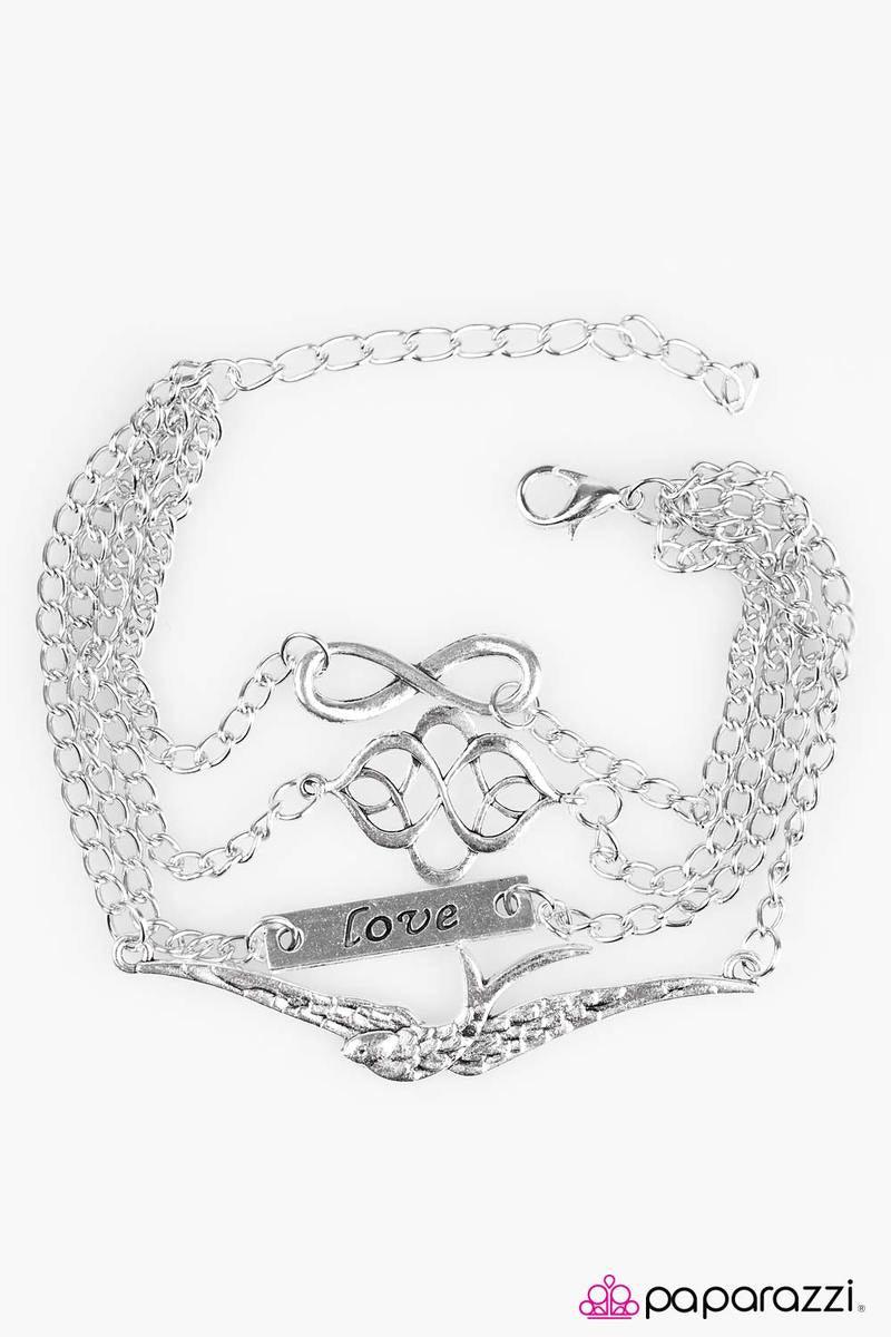 Paparazzi Accessories Then Love Swooped In - Silver Four layers of silver chain are embellished with silver charms. Charms include a textured bird, an infinity sign, a filigree-swirled fitting and a rectangular silver plate with the word "love" etched int