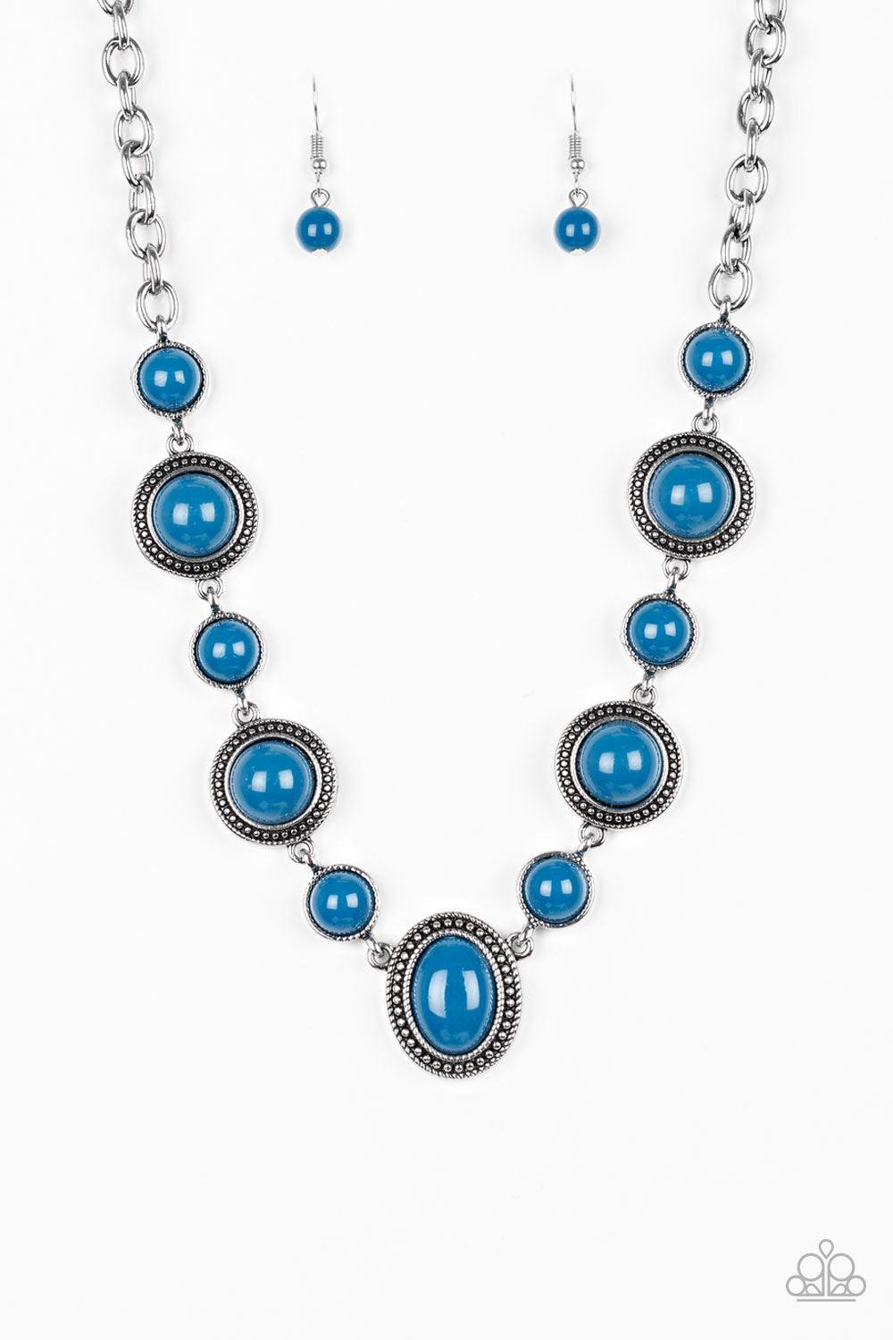 Paparazzi Accessories Voyager Vibes ~Blue Featuring smooth and studded silver frames, refreshing blue beads link below the collar in a seasonal fashion. Features an adjustable clasp closure. Sold as one individual necklace. Includes one pair of matching e