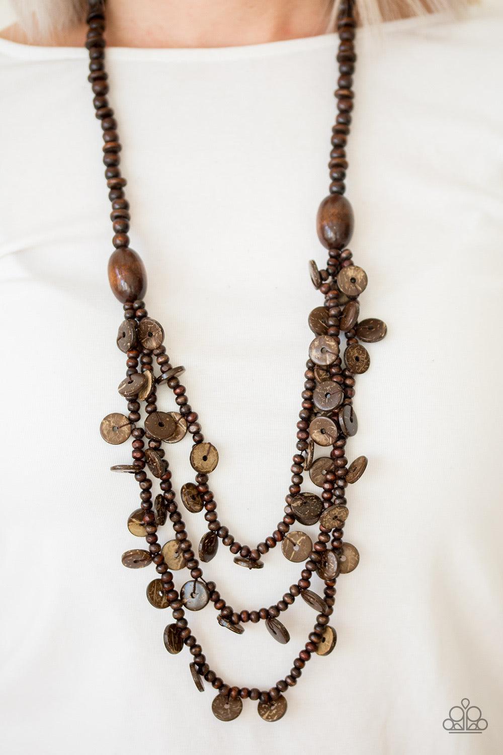 Paparazzi Accessories Safari Samba - Brown Brushed in an earthy brown finish, two bold wooden beads give way to summery layers. Brushed in a distressed finish, dainty wooden discs swing from the bottom of the layers for a flirty finish. Jewelry
