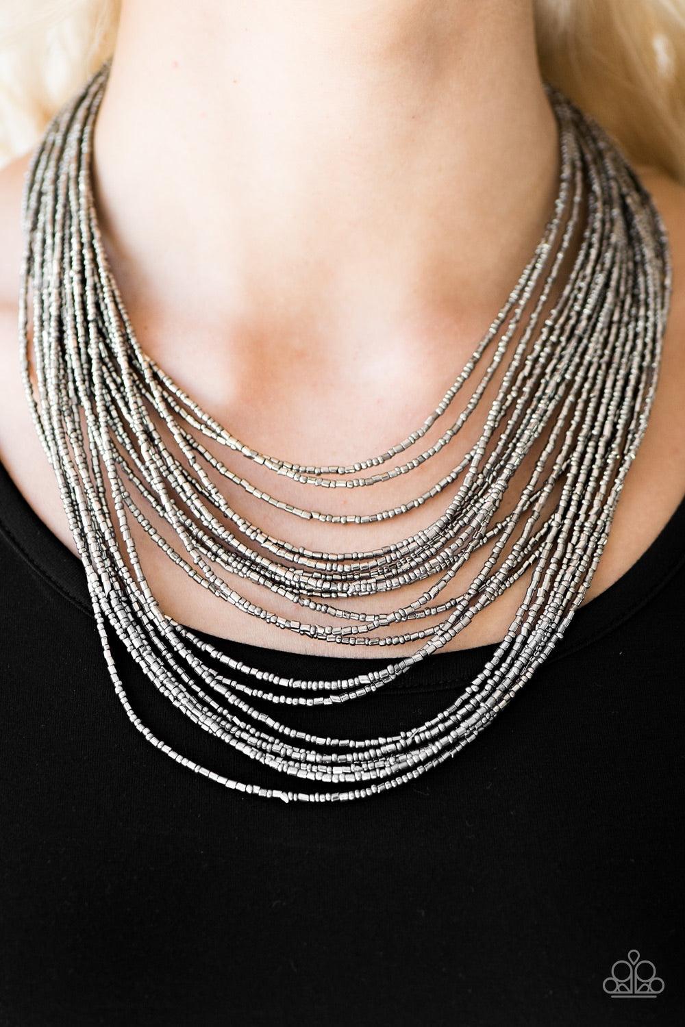 Paparazzi Accessories Ice Age Radiance - Silver Brushed in an icy metallic shimmer, strands of dainty seed beads layer below the collar in an edgy fashion. Features an adjustable clasp closure. Jewelry