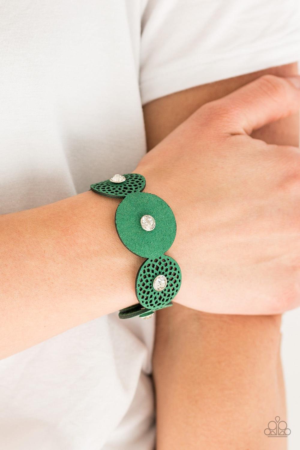 Paparazzi Accessories Poppin Popstar - Green Dotted with white rhinestone centers, round green suede frames join across the wrist for a whimsical look. Features an adjustable snap closure. Jewelry
