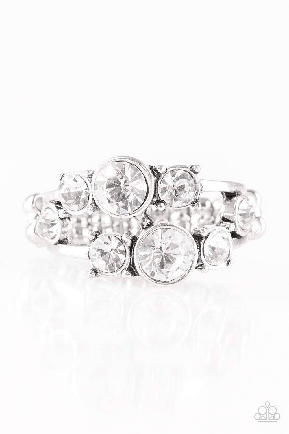 Paparazzi Accessories Interstellar Fashion - White Rows of glittery white rhinestones connect across the finger, coalescing into a glamorous band. Features a dainty stretchy band for a flexible fit. Jewelry
