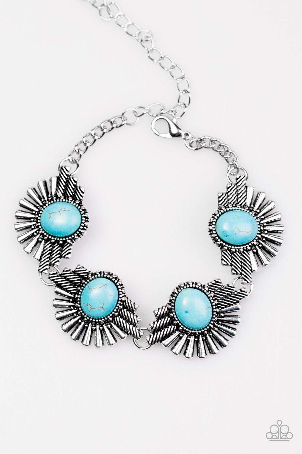Paparazzi Accessories Desert Marvel - Blue Earthy turquoise beads are pressed into the centers of flared silver frames for a handcrafted look. The tribal inspired frames link across the wrist in a simply seasonal fashion. Features an adjustable clasp clos