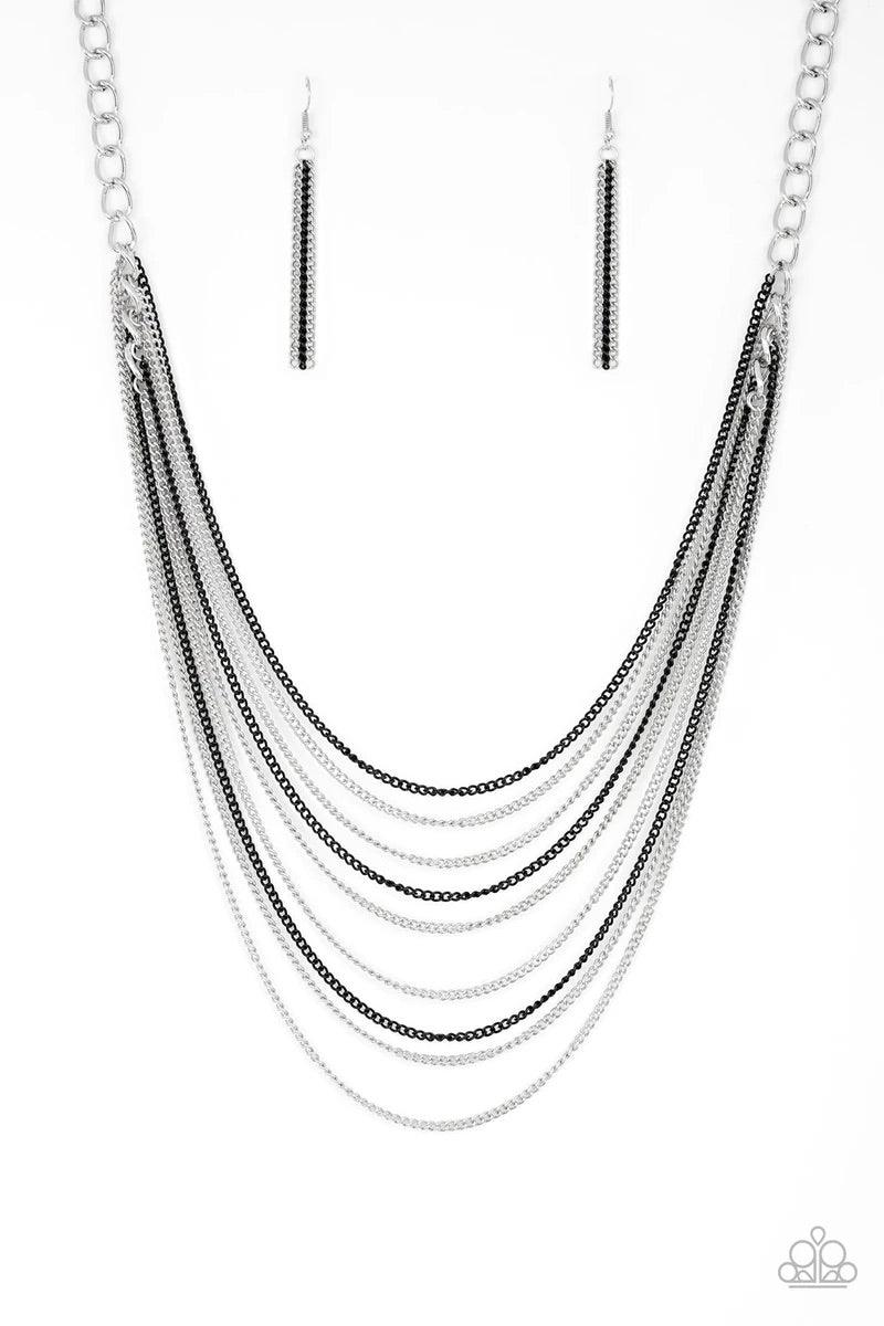 Paparazzi Accessories Rebel Rainbow - Black Strands of bold silver links give way to rows of shimmery silver and shiny black chains, creating colorful layers down the chest. Features an adjustable clasp closure. Sold as one individual necklace. Includes o