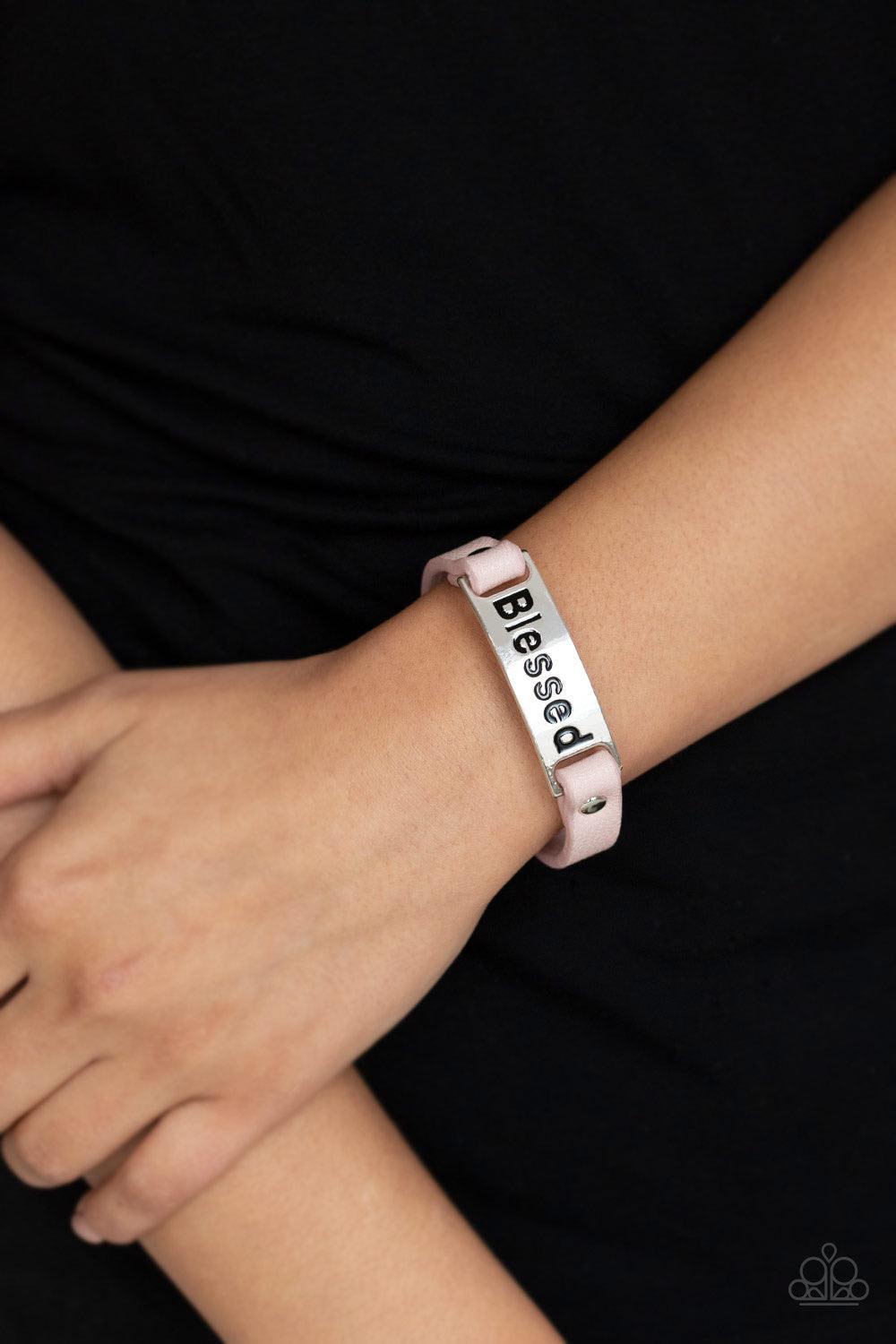 Paparazzi Accessories Count Your Blessings - Pink Stamped in the word, "Blessed" a shiny silver plate is studded in place along a dainty pink leather band for a whimsical look. Features an adjustable snap closure. Jewelry