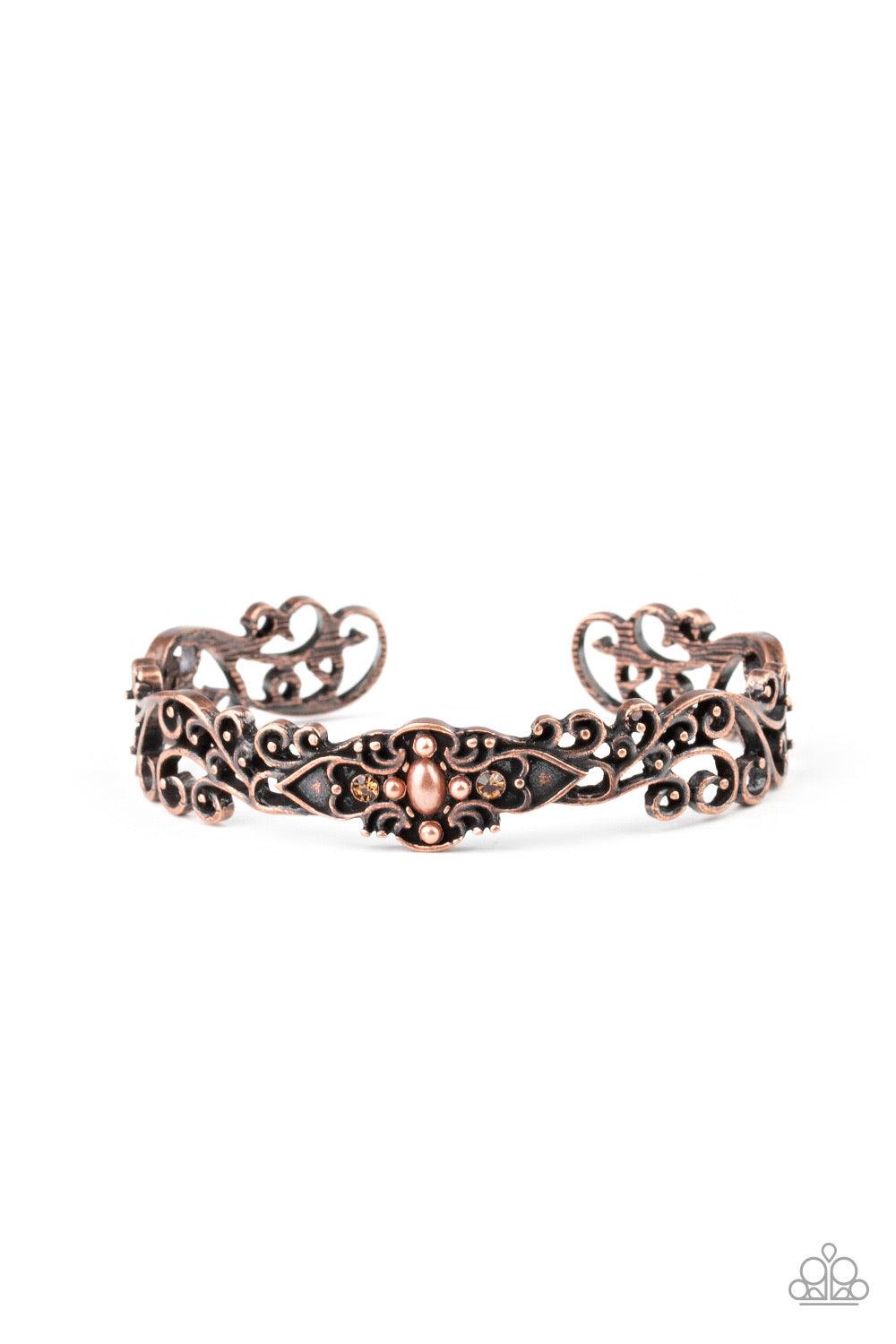 Paparazzi Accessories Victorian Vines ~ Copper Brushed in an antiqued finish, copper filigree vines across the wrist, coalescing into a delicate cuff. Dainty topaz rhinestones and pearly copper beads adorn the center of the cuff for a whimsical finish. So