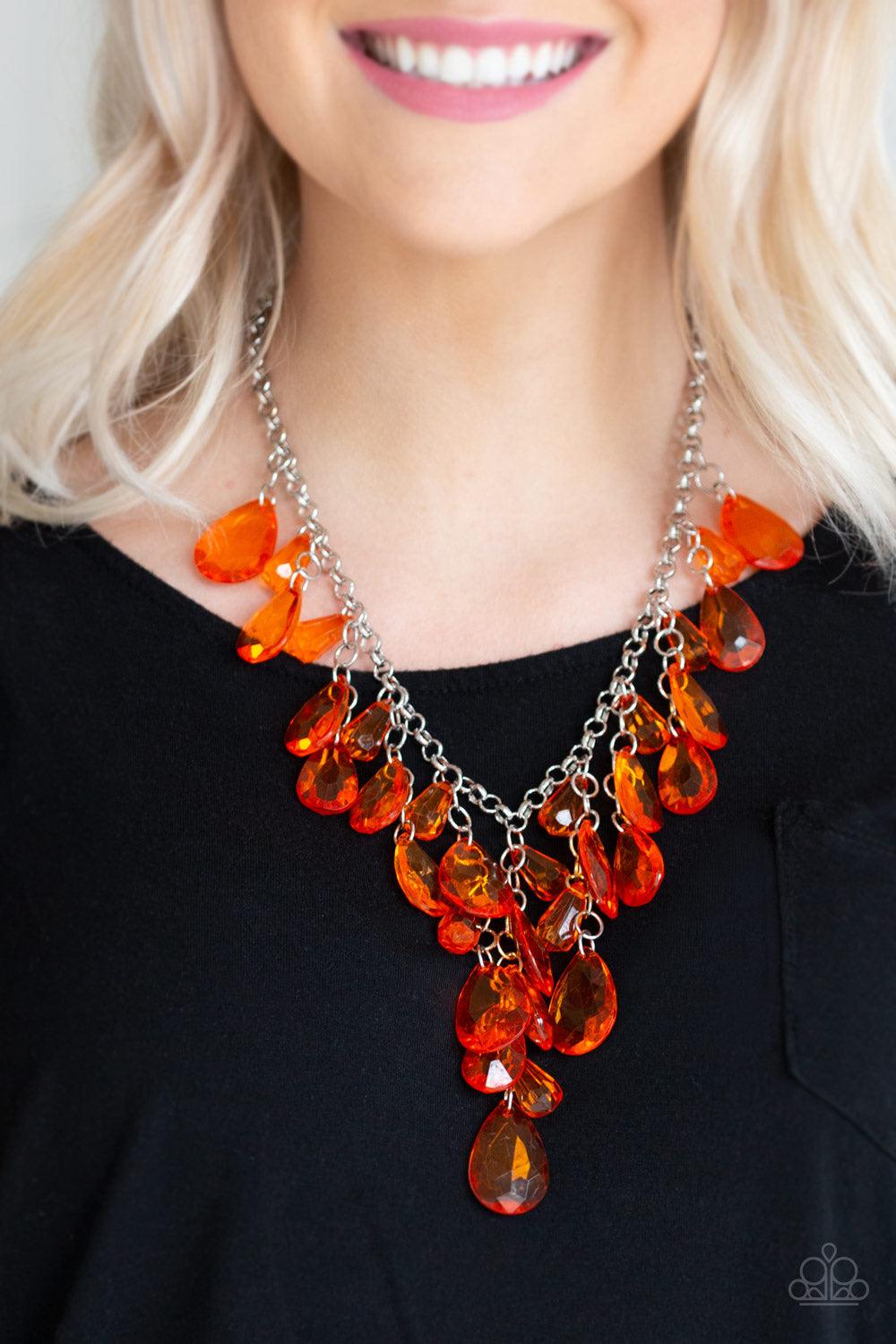 Paparazzi Accessories Irresistible Iridescence - Orange Glassy orange teardrops and glassy orange beads swing from the bottom of a shimmery silver chain. Matching beads trickle down free-falling chains, creating a glamorous fringe below the collar. Featur