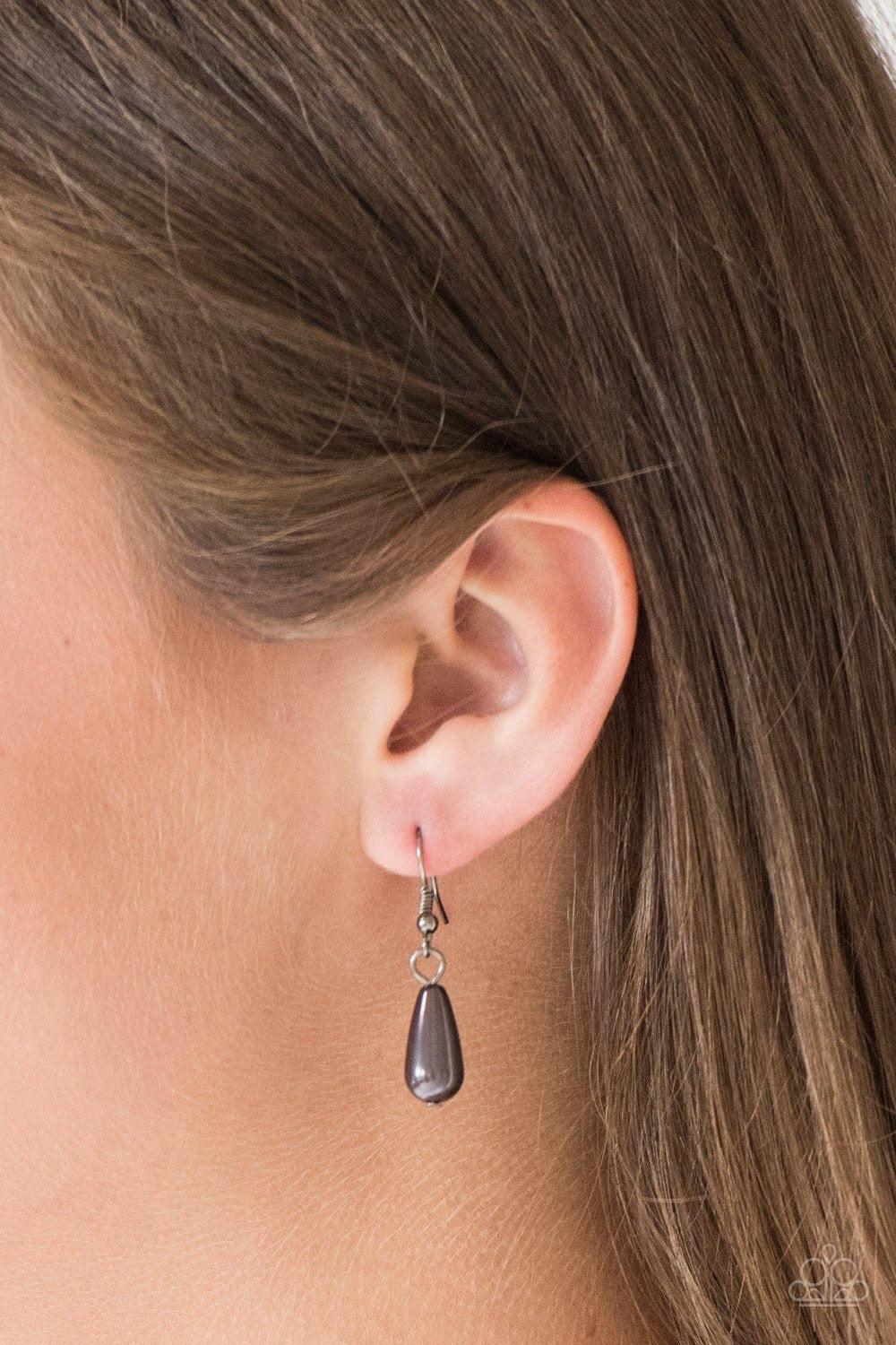Paparazzi Accessories Rustic Ritz - Black Pearly gunmetal teardrop beads swing from the tops of delicately hammered gunmetal teardrop frames, creating a refined fringe below the collar. Features an adjustable clasp closure. Sold as one individual necklace