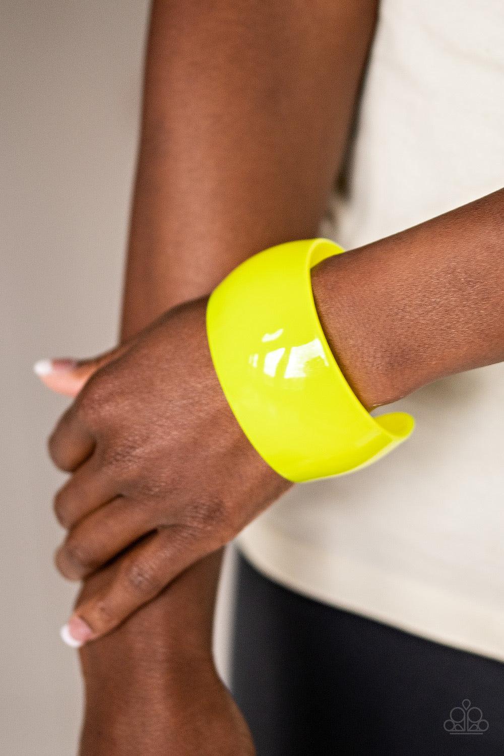 Paparazzi Accessories Fluent in Flamboyance - Yellow A neon yellow acrylic cuff curls around the wrist for a colorfully retro look. Jewelry