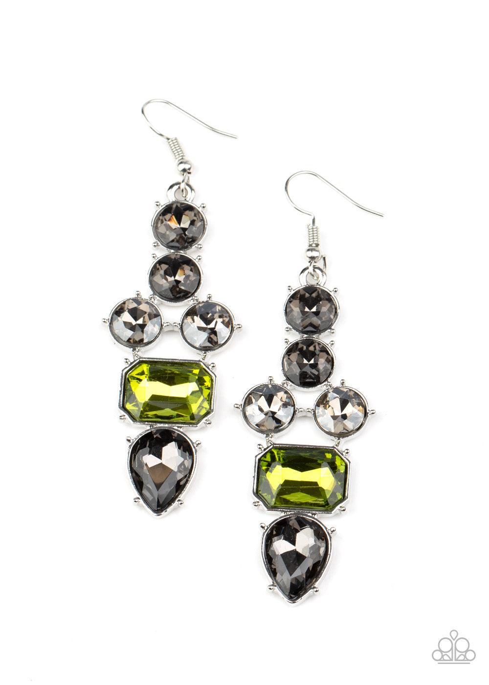 Paparazzi Accessories Look At Me GLOW! - Green Featuring emerald, round, and teardrop shapes, a sparkly series of smoky and green rhinestones coalesce into a dramatically regal lure. Earring attaches to a standard fishhook fitting. Sold as one pair of ear