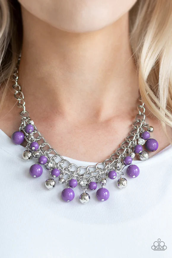Paparazzi Accessories The Bride To BEAD - Purple Varying in size, a collection of vivacious purple and shiny silver beads swing from the bottom of interlocking silver chains below the collar. A row of glassy white rhinestones are sprinkled along the color