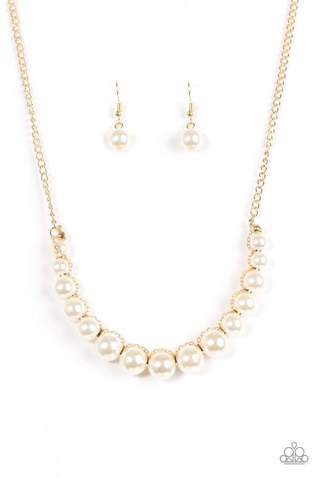 Paparazzi Accessories The FASHION Show Must Go On! - Gold A classic strand of white pearls is threaded along an invisible string, creating a stationary pendant below the collar. Infused with shimmery gold accents, gold chain weaves atop the pearls for a r