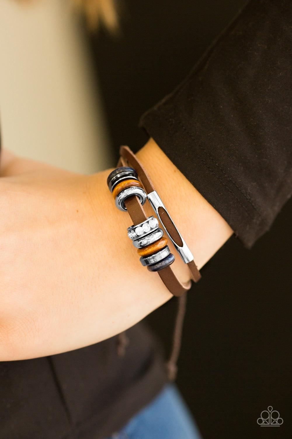 Paparazzi Accessories Summer Classic - Brown Featuring an array of rhinestone, wooden, and metallic accents, leather bands layer across the wrist for an urban look. Features an adjustable sliding knot closure. Jewelry