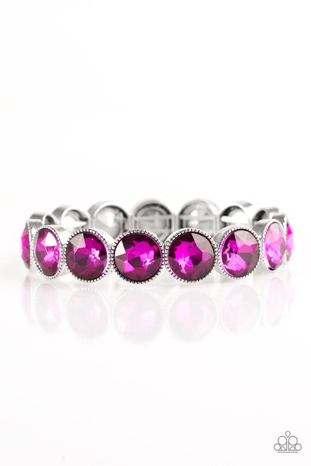 Paparazzi Accessories Number One Knockout - Pink Faceted pink gems are pressed into sleek silver frames. The glittery frames are threaded along elastic stretchy bands, creating a glamorous look around the wrist. Sold as one individual bracelet. Jewelry