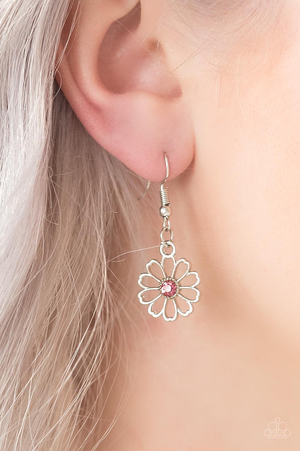 Paparazzi Accessories Daffodil Gardens - Pink Stenciled silver floral charms link below the collar. Glittery pink rhinestones dot the floral centers, adding a whimsical finish to the airy palette. Features an adjustable clasp closure. Sold as one individu