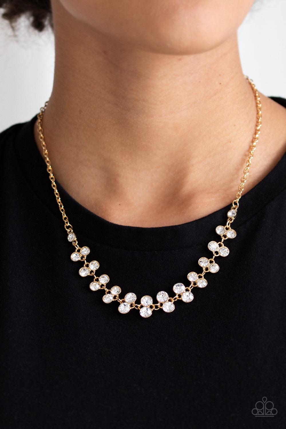 Paparazzi Accessories Super Starstruck - Gold Pairs of glittery white rhinestones join below the collar for a timeless look. Features an adjustable clasp closure. Jewelry