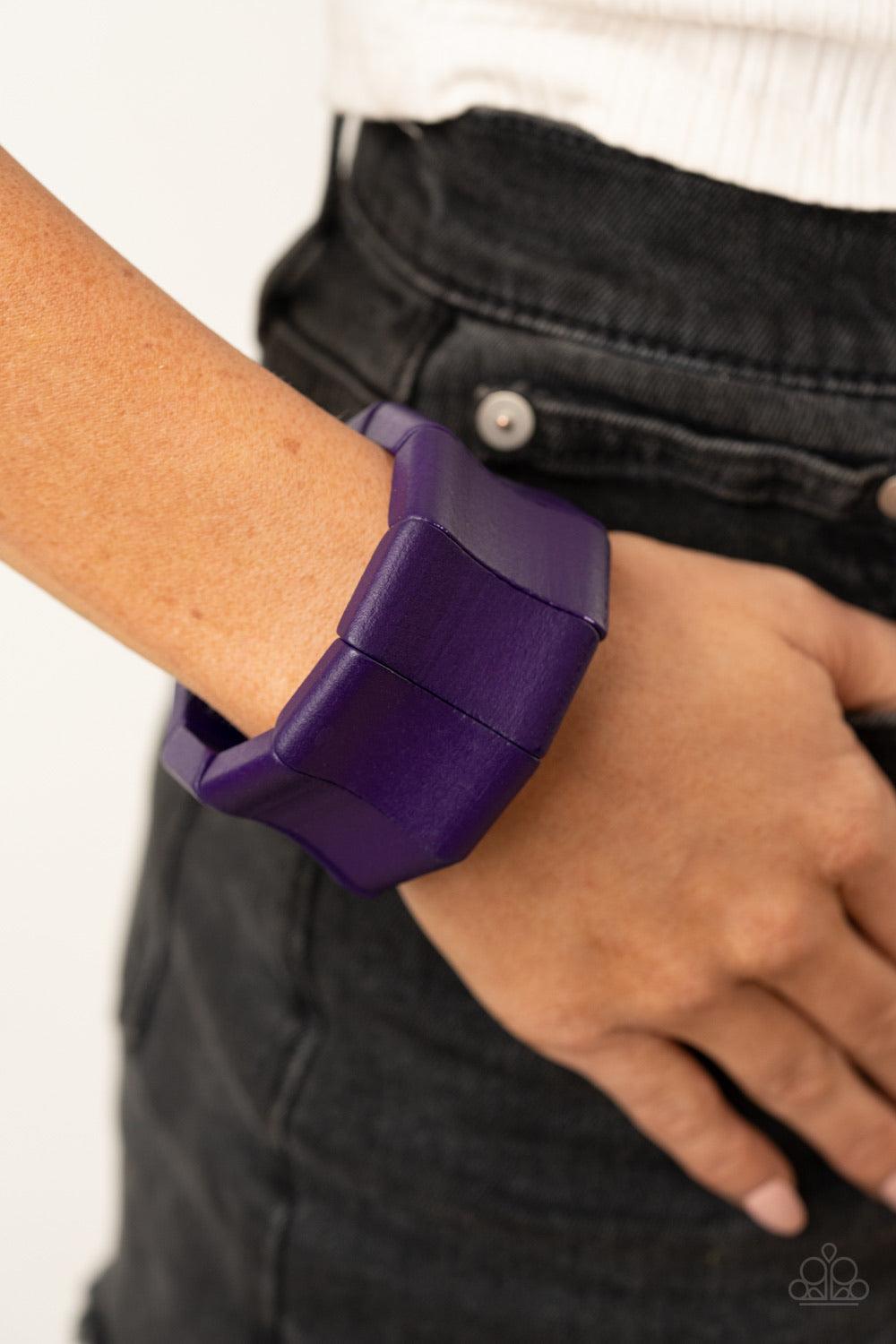 Paparazzi Accessories Caribbean Couture - Purple Featuring curved rectangular shapes, oversized vivacious purple wooden beads are threaded along stretchy bands around the wrist for a bold summer look. Sold as one individual bracelet. Jewelry