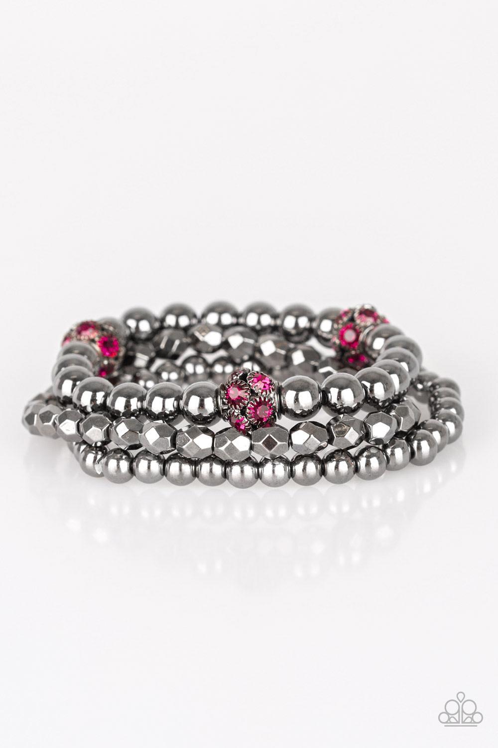 Paparazzi Accessories Noticeably Noir - Pink Mismatched gunmetal beads and pink rhinestone encrusted beads are threaded along stretchy bands for an edgy and refined look. Sold as one set of three bracelets. Jewelry
