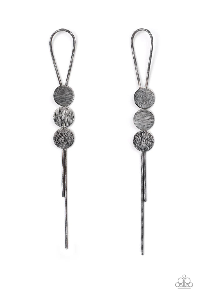 Paparazzi Accessories Bolo Beam - Black A gunmetal loop of round snake chain is held in place by a trio of scratched gunmetal discs, creating a trendy bolo-like lure. Earring attaches to a standard post fitting. Sold as one pair of post earrings. Jewelry