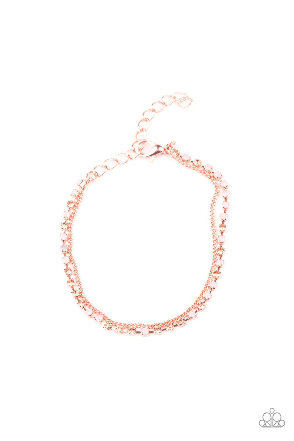 Paparazzi Accessories Double The Diamonds - Copper Infused with a dainty shiny copper chain, a glittery collection of peach and opaque pink rhinestones delicately link across the wrist, creating glittery layers. Features an adjustable clasp closure. Sold