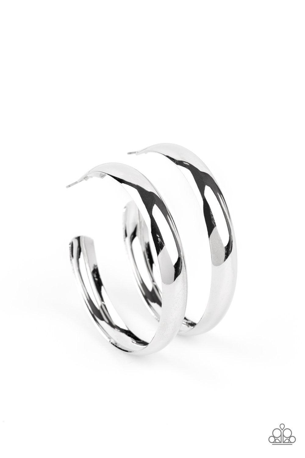 Paparazzi Accessories Kick ‘Em To The Curve - Silver A flat silver bar delicately curls into an oversized hoop for a bold industrial look. Earring attaches to a standard post fitting. Hoop measures approximately 2 1/4" in diameter. Sold as one pair of hoo