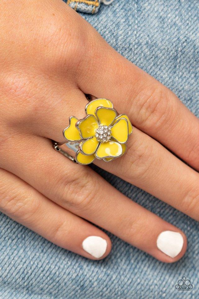 Paparazzi Accessories Hibiscus Holiday - Yellow Painted in a sunny yellow finish, colorful petals gather around a white rhinestone encrusted center for a whimsically flowering look atop the finger. Features a stretchy band for a flexible fit. Jewelry