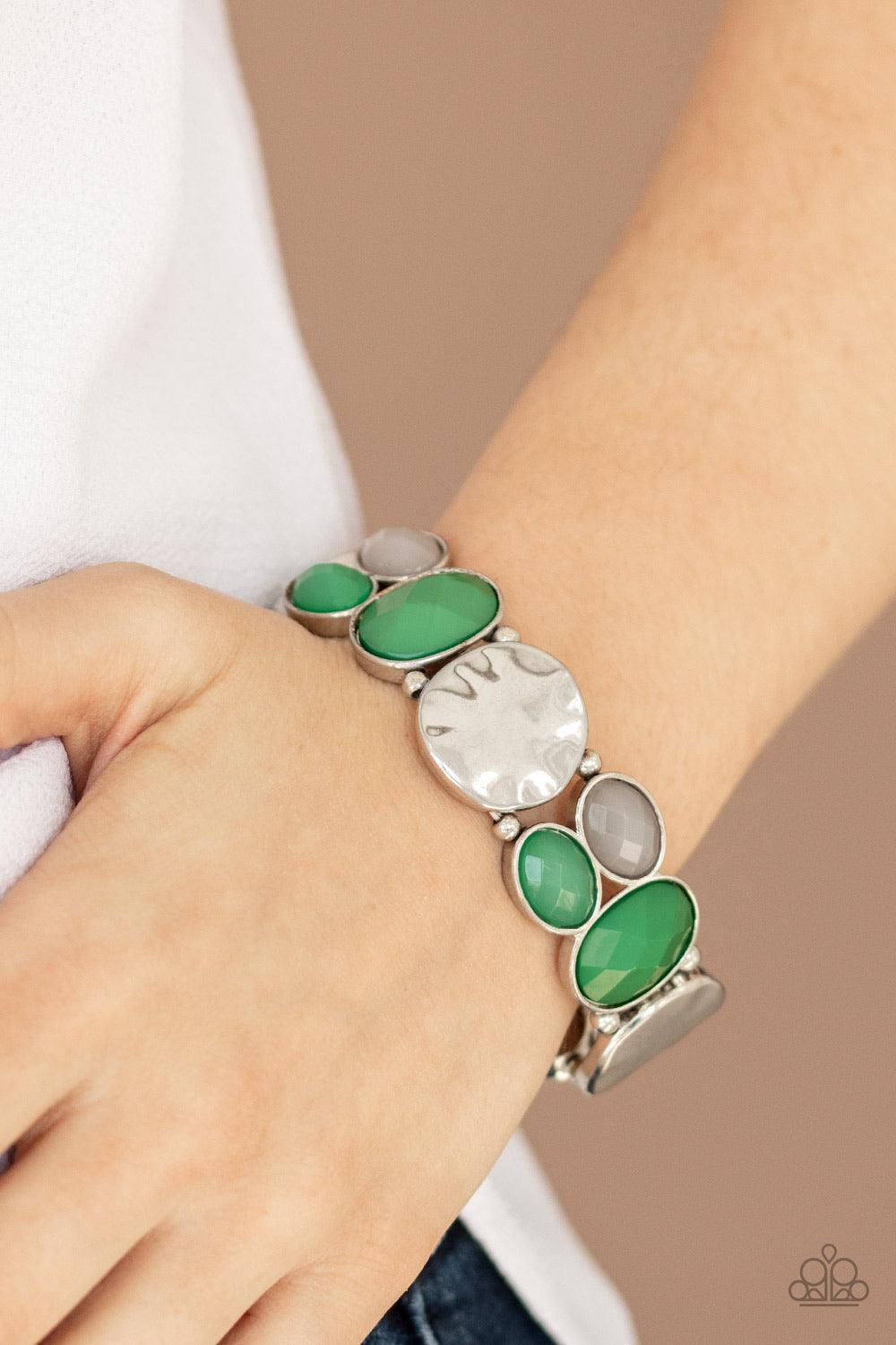 Paparazzi Accessories Chroma Charisma - Green A mismatched collection of hammered silver pieces and faceted opaque and Eden beads are threaded along a stretchy band around the wrist for a dramatically colorful look. Jewelry