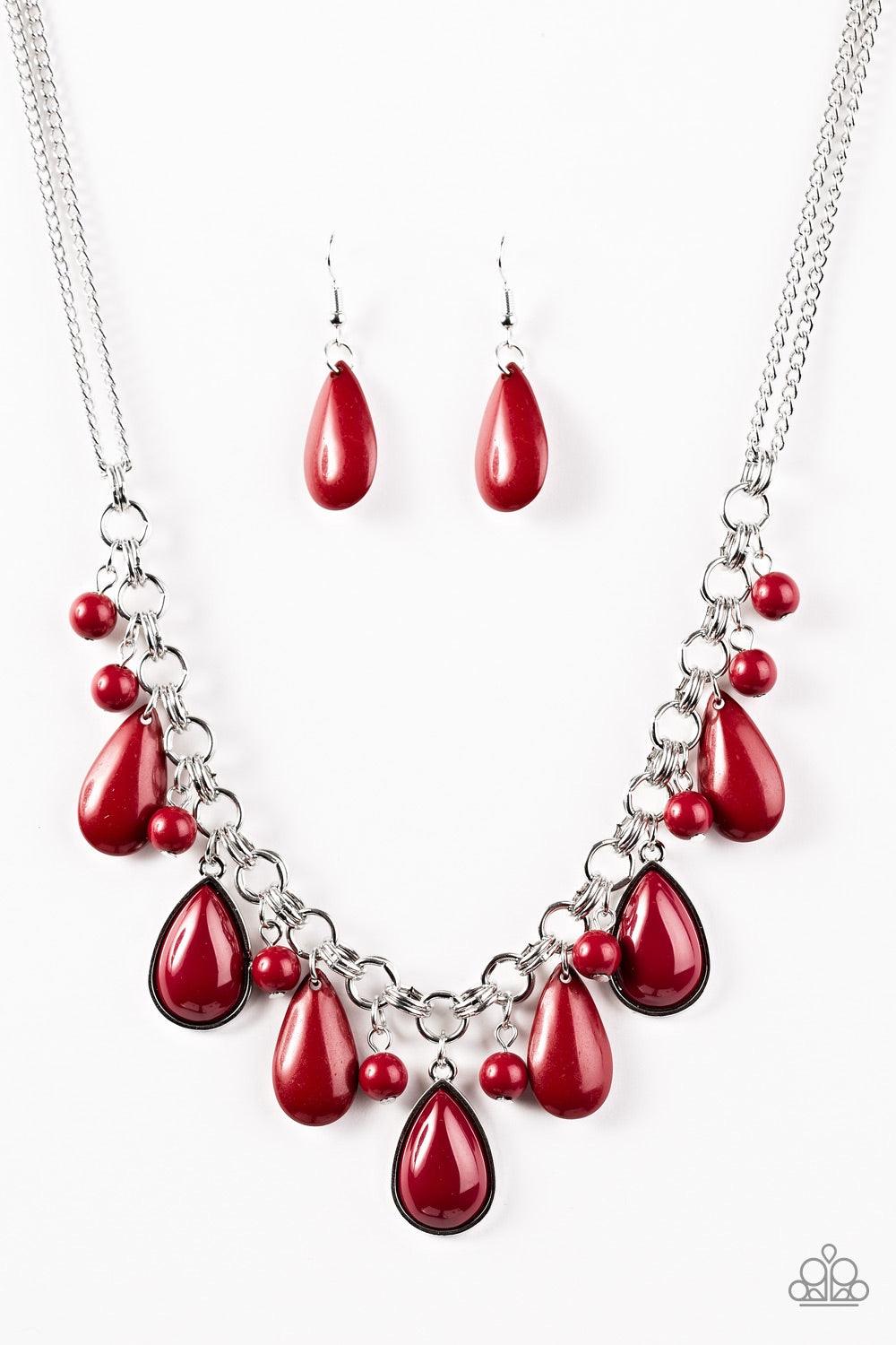 Paparazzi Accessories This Side of Malibu - Red Polished red beads and teardrops cascade from the bottom of a dramatic silver chain. Three red teardrops are pressed into sleek silver frames, catching and reflecting the light as the flirty fringe falls jus