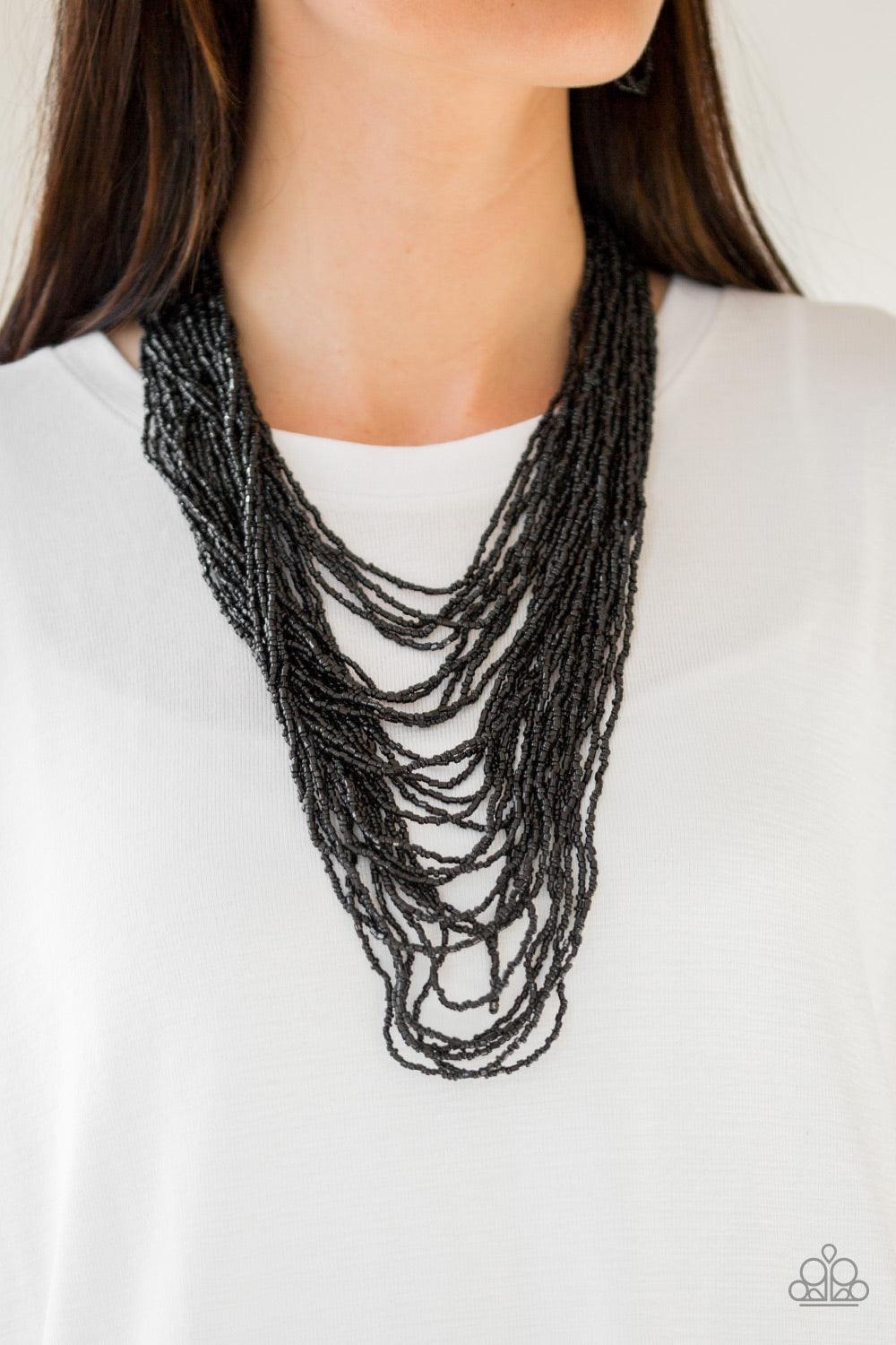 Paparazzi Accessories Dauntless Dazzle - Black Brushed in an icy metallic shimmer, countless strands of black seed beads drape across the chest in a bold fashion. Featuring a collision of shapes and shimmer, the glittery strands connect to two large silve