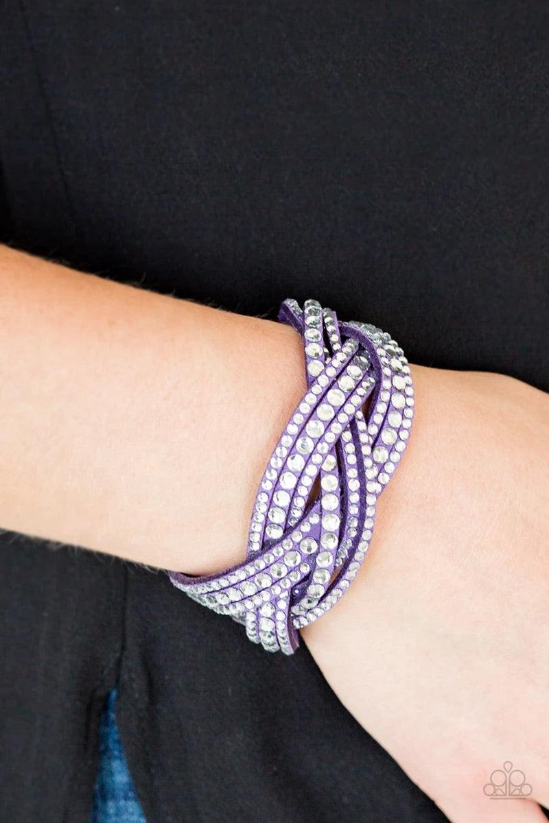 Paparazzi Accessories Bring on the Bling - Purple Bring On The Bling -Purple Urban Bracelet -Varying in size, glassy white rhinestones are encrusted along interwoven purple suede bands, creating blinding shimmer across the wrist. Features an adjustable sn