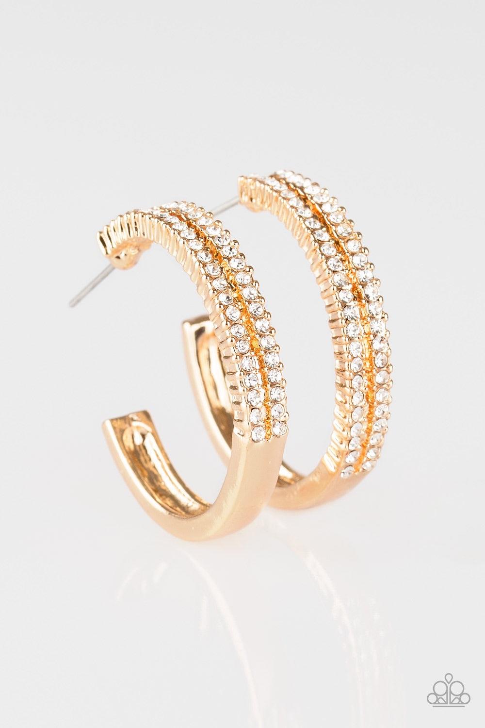 Paparazzi Accessories Slay Your Way ~Gold Two rows of glittery white rhinestones are encrusted along the top half of a glistening gold hoop for a glamorous look. Earring attaches to a standard post fitting. Hoop measures 1" in diameter.