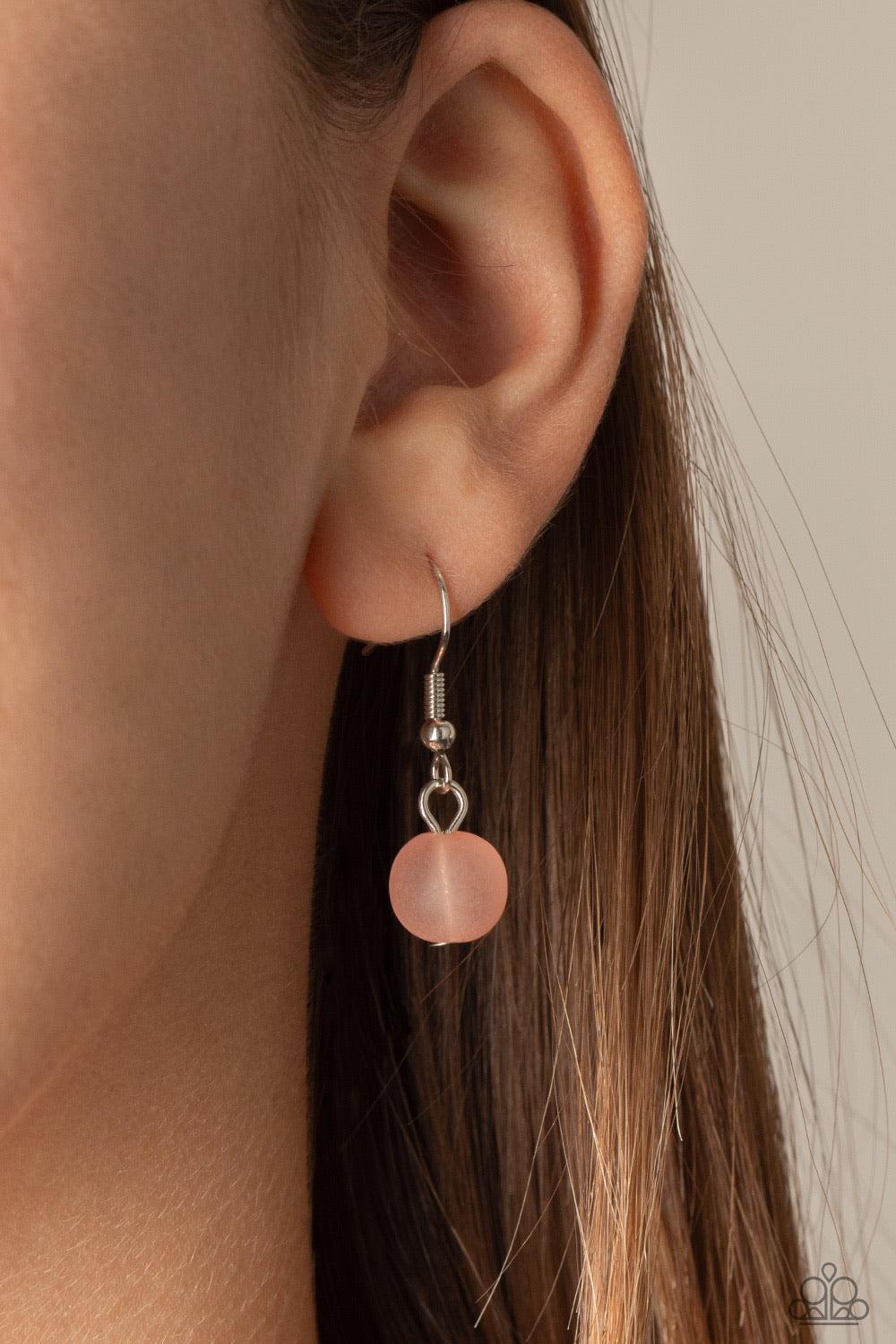 Paparazzi Accessories Arctic Art - Pink Featuring round and imperfectly flat shapes, an icy compilation of opaque Rose Tan beads are threaded along invisible wires, creating colorfully glassy layers below the collar. Features an adjustable clasp closure.